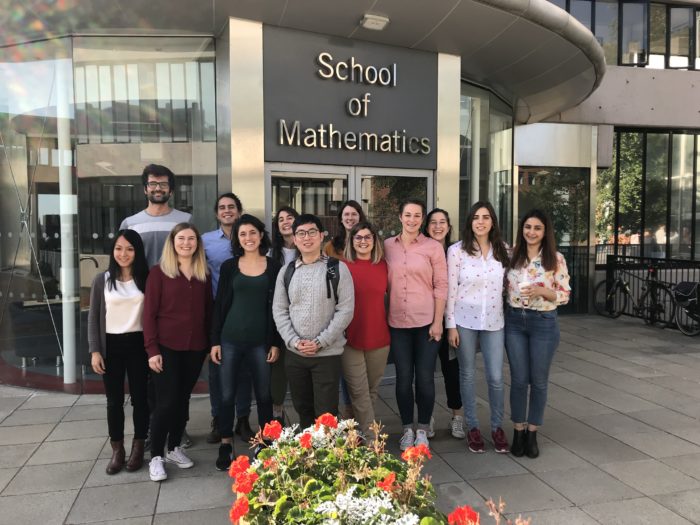 Participants of the QuanTII meeting standing outside the main entrance of the School of Mathematics